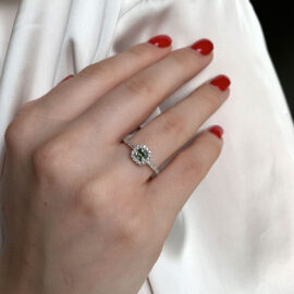 Cushion green sapphire pavé halo diamond engagement ring mood picture
