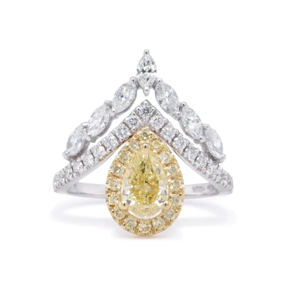 Yellow pear diamond ring set in 18k white and yellow gold with a 0.81 ct GIA Fancy Yellow pear cut centre diamond and 0.22 ct yellow diamond halo.