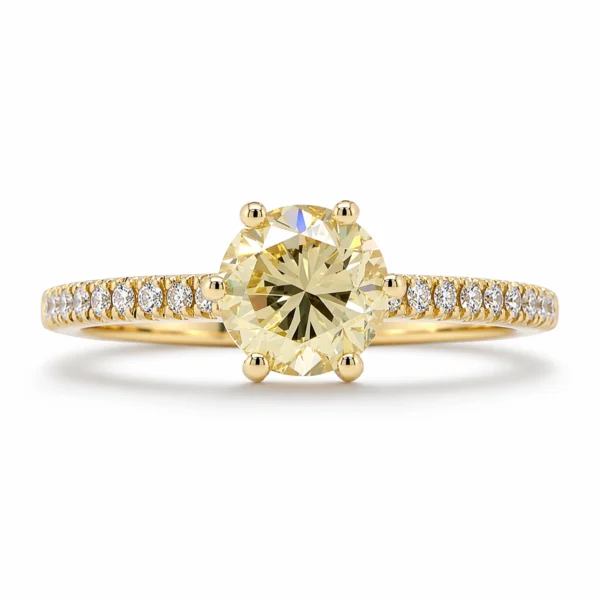 Front view of a 1 carat yellow diamond pavé engagement ring in 18k yellow gold with a GIA-certified 1.00 ct FLY SI2 round diamond and 0.12 ct D–F VS pavé diamonds.