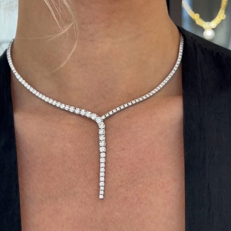 This 18K White Gold Diamond Drop Necklace Features A Harmonious Cascade Of 10.81 Carats Of Brilliant Round-Cut Diamonds