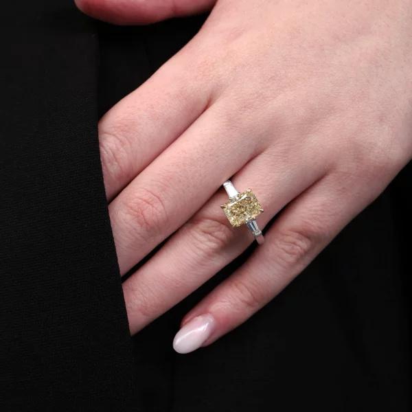 luxury yellow diamond ring with radiant center and tapered baguettes