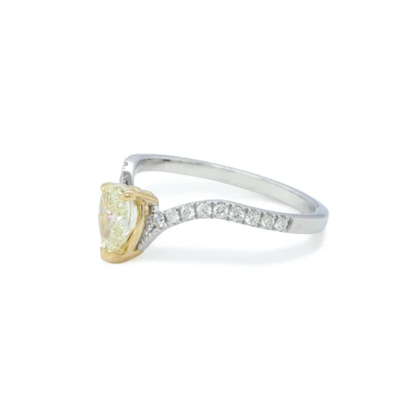 0.70 ct W-X pear diamond GIA ring with side diamonds
