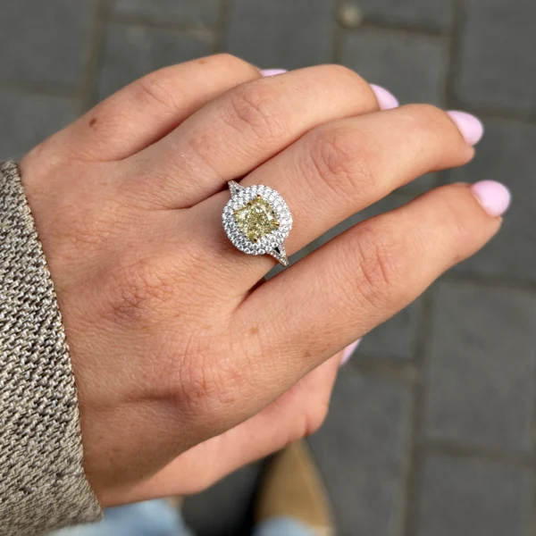 Cushion cut yellow diamond ring with split shank and diamond pavé details
