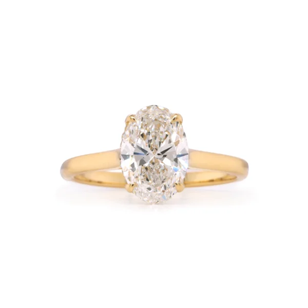 Oval-cut 1.51 ct D VS1 diamond ring with hidden halo in 18k yellow gold, front view.