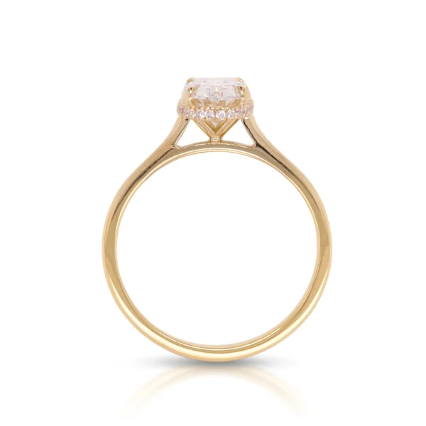 Side profile of 1.51 ct D VS1 oval diamond ring with hidden halo in yellow gold.