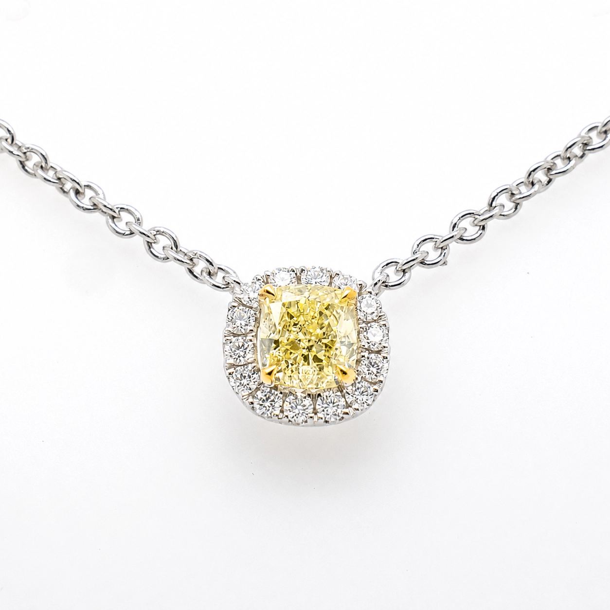 Yellow Diamond Halo Pendant In 18K White Gold With Natural Diamonds 1 - Orogem Jewelers Yellow Diamond Halo Pendant In 18K White Gold With A 0.43 Ct Y-Z If Center Diamond And 0.08 Ct D-F Vs Natural Diamonds, Close-Up View.