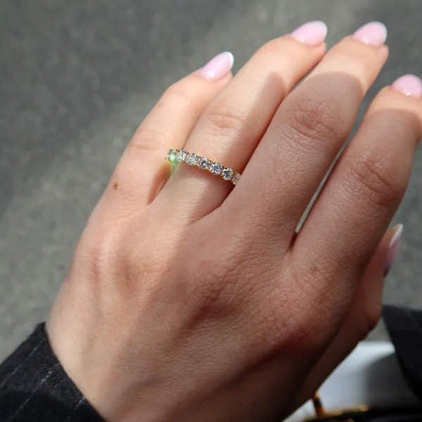 Elegant 18K yellow gold diamond band ring set with 0.82 carats of natural round brilliant cut diamonds in D–F colour and VS clarity, offering refined sparkle and timeless sophistication