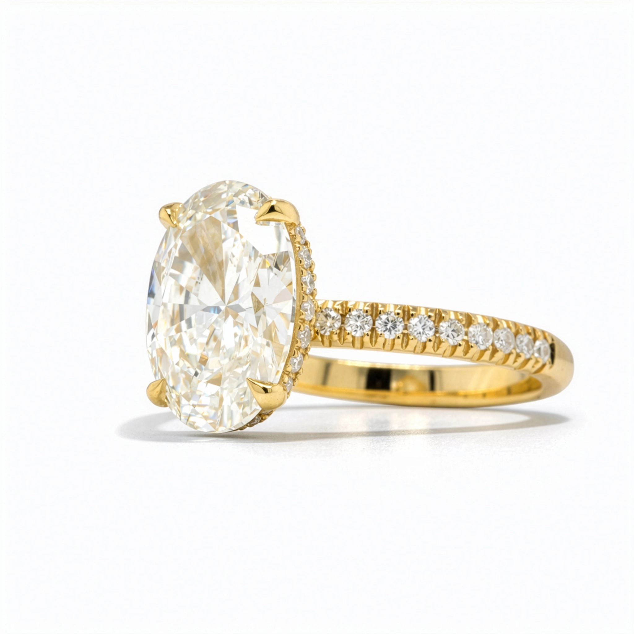 Elegant Yellow Gold 18K Ring With 3.00 Ct Lab-Grown Oval Diamond 4 - Orogem Jewelers Three-Quarter View Of Oval Cut 3.02 Carat Lab-Grown Diamond Engagement Ring In 18K Yellow Gold With Pavé Side Diamonds And Four-Prong Setting