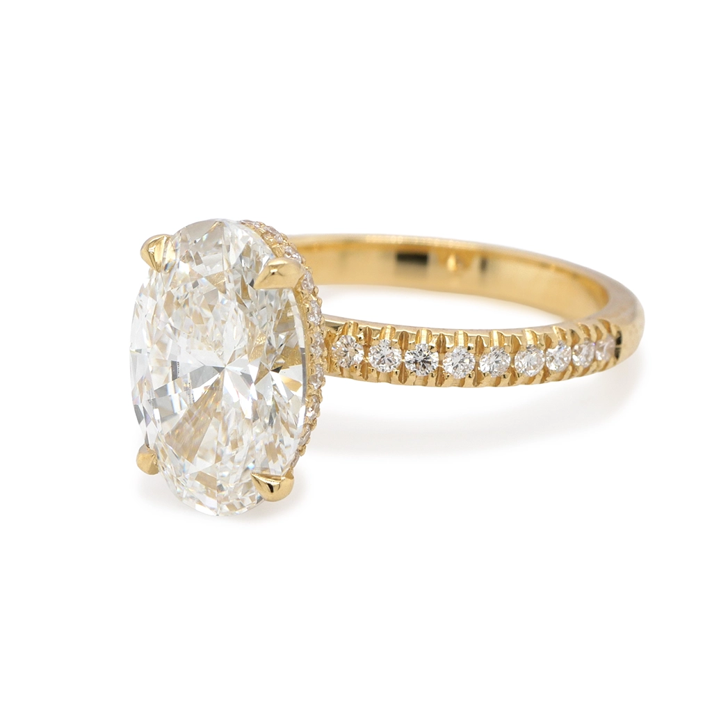 Elegant Yellow Gold 18K Ring With 3.00 Ct Lab-Grown Oval Diamond 5 - Orogem Jewelers Three-Quarter View Of Oval Cut 3.02 Carat Lab-Grown Diamond Engagement Ring In 18K Yellow Gold With Pavé Side Diamonds And Four-Prong Setting