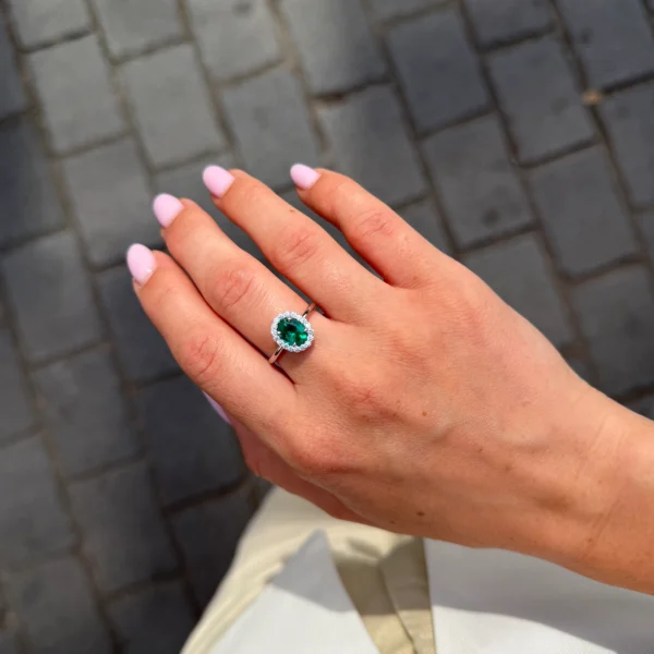Emerald And Diamond Halo Ring In 18K White Gold