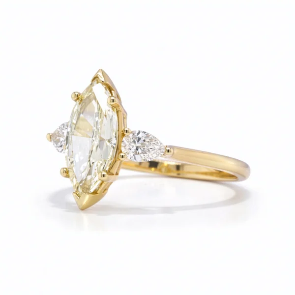 Side view marquise 1.50 ct natural diamond engagement ring in 18k yellow gold with pear side diamonds, GIA certified