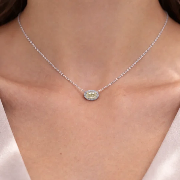1.02 ct oval Fancy Light Yellow diamond halo necklace GIA SI1 18K white and yellow gold