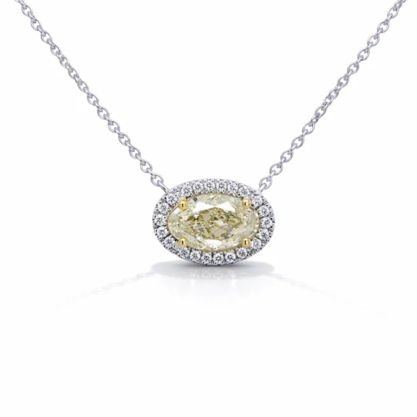 1.02 ct oval Fancy Light Yellow GIA-certified diamond halo necklace in 18k white gold with 0.10 ct D–F VS diamonds, 40–42 cm chain.