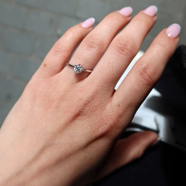 Classic 0.50 carat solitaire diamond ring in polished 18K white gold featuring a natural G SI1 GIA-certified diamond secured in an elegant six-prong setting