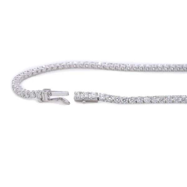 Close detail of clasp and diamond setting on an 18k white gold diamond tennis bracelet with 1.99 ct natural diamonds.