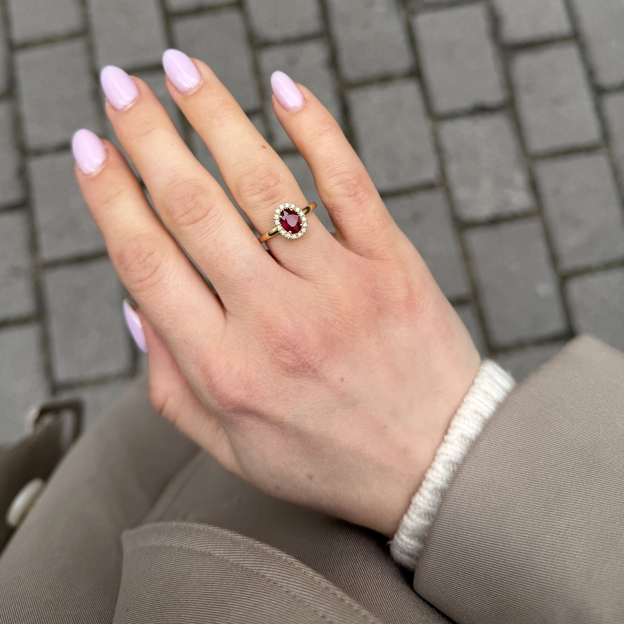 Natural Ruby Halo Ring In 18K Yellow Gold With Oval Ruby Diamonds 4 - Orogem Jewelers Oval Natural Ruby Halo Ring Worn On The Hand In 18K Yellow Gold With A Delicate Surround Of Natural Diamonds.
