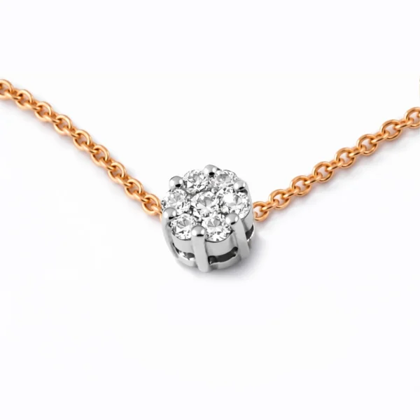 18k rose gold diamond cluster bracelet with 0.07 ct G SI natural diamonds, featuring seven small diamonds arranged to create the illusion of a larger centre stone.