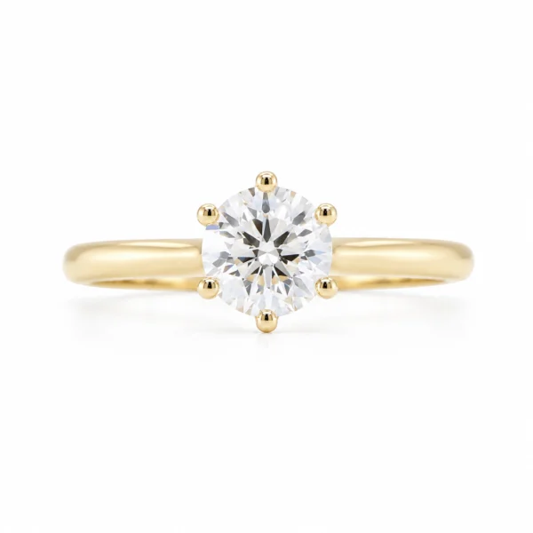 0.70 ct round brilliant GIA solitaire diamond ring in 18K yellow gold