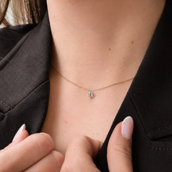 18k rose gold necklace worn on the neck with a floating 0.50 ct round lab grown diamond pendant.