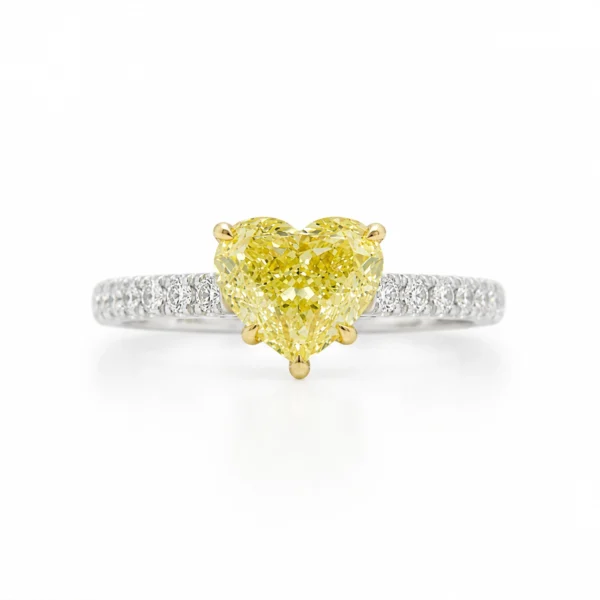 Fancy yellow heart diamond ring in 18k white and yellow gold with a 1.52 ct GIA-certified center diamond and 0.14 ct D-F VS diamonds, front view.