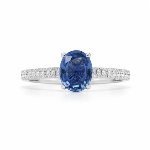 Oval sapphire engagement ring in 18k white gold with a 1.02 ct oval sapphire and 0.12 ct D-F VS diamonds, front view.