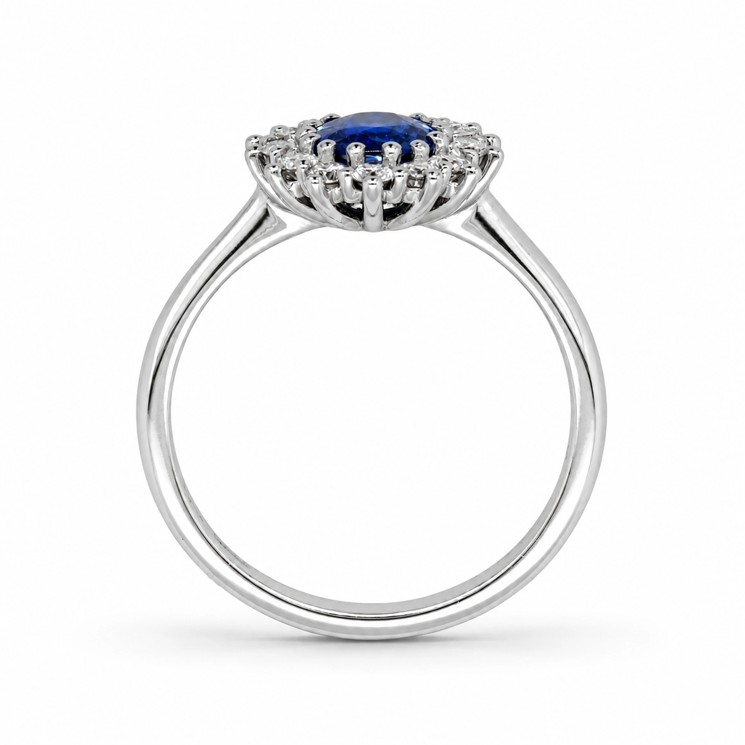 Oval Sapphire Halo Ring In 18K White Gold With 1.01 Ct Sapphire Center4 Side View Of An Oval Sapphire Halo Ring In 18K White Gold Showing The Elevated Cluster Setting.