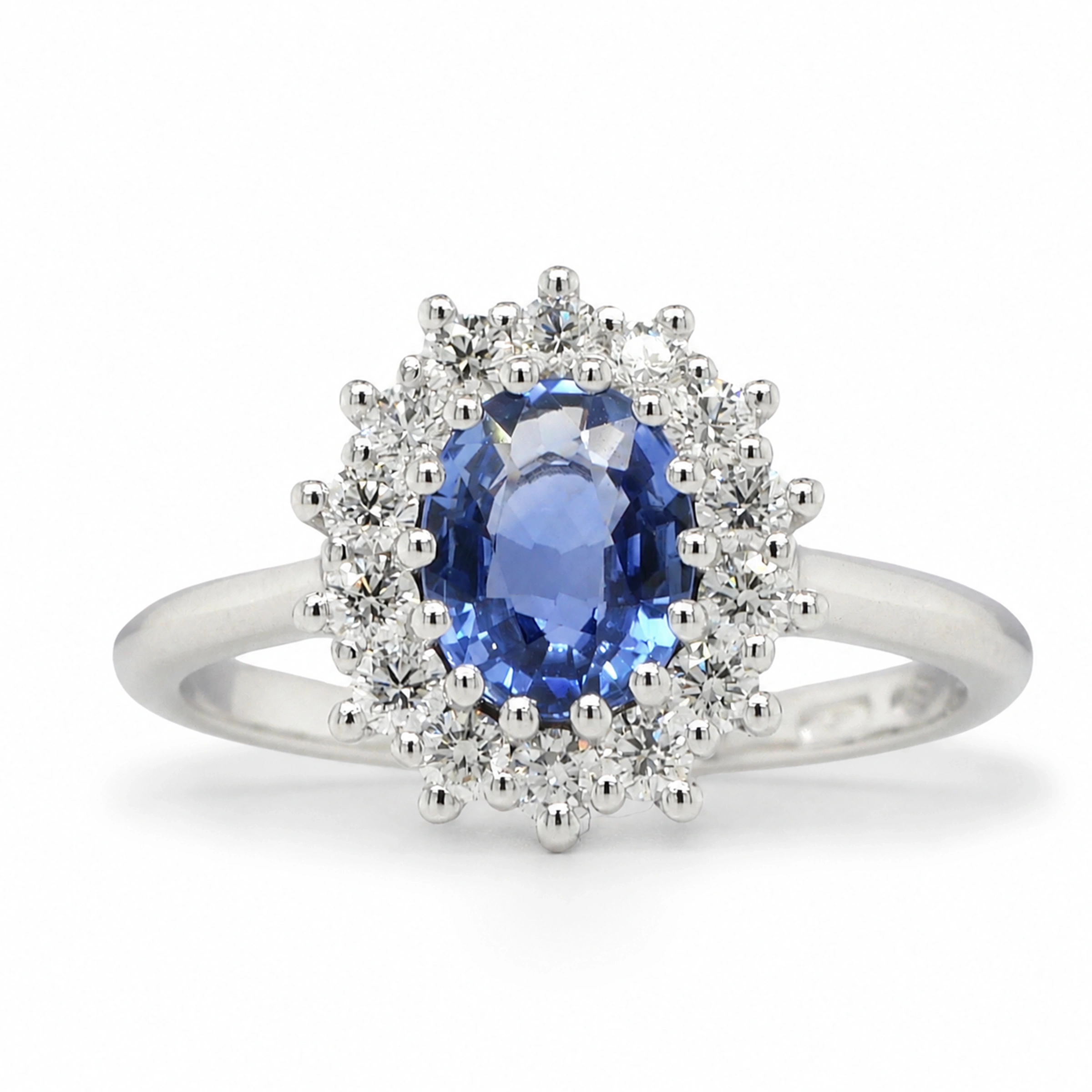Oval Sapphire Halo Ring In 18K White Gold With 1.01 Ct Sapphire Center5 Oval Sapphire Halo Ring In 18K White Gold With A 1.01 Ct Sapphire And 0.36 Ct D-F Vs Diamonds, Front View.
