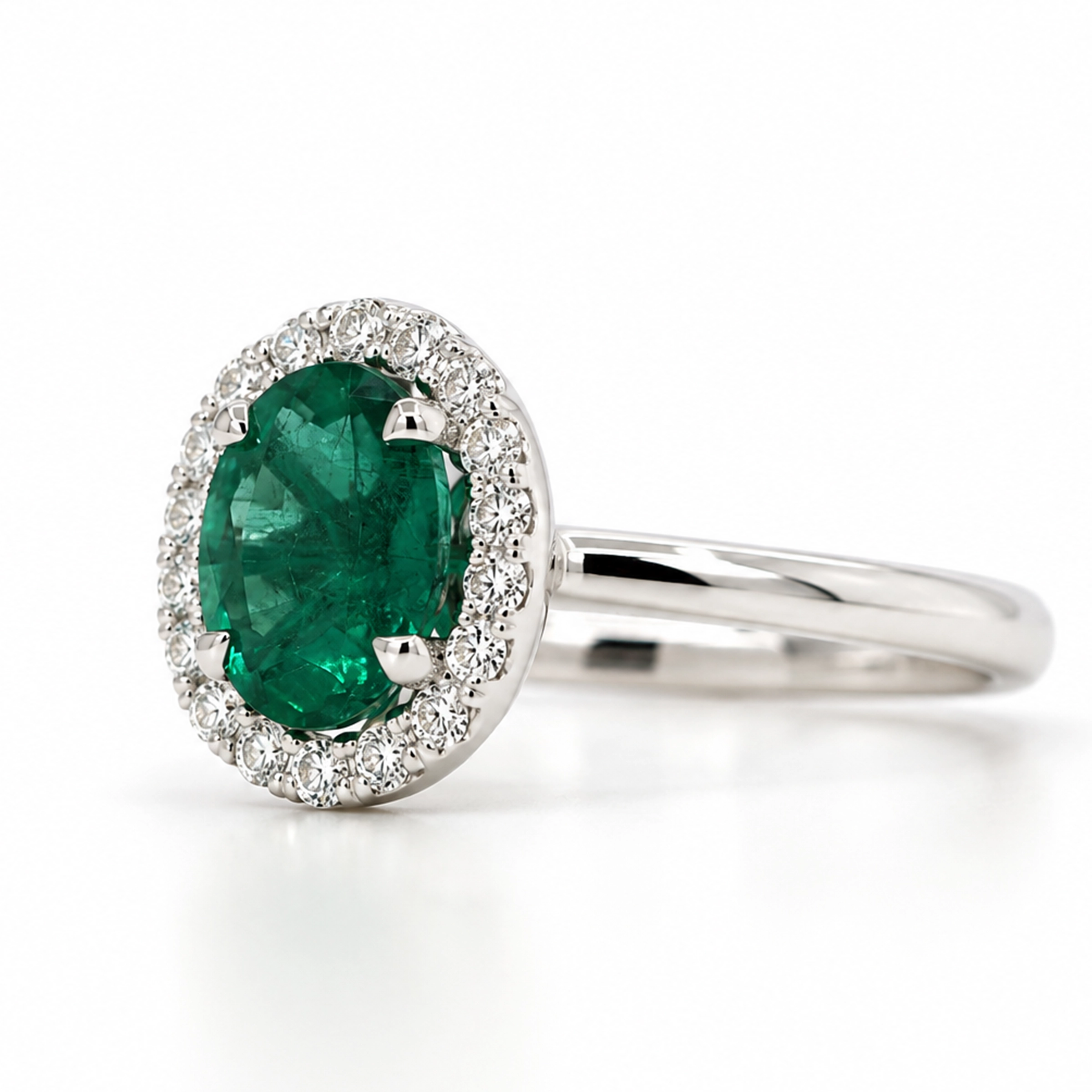 Emerald And Diamond Halo Ring In 18K White Gold3 Emerald And Diamond Halo Ring In 18K White Gold