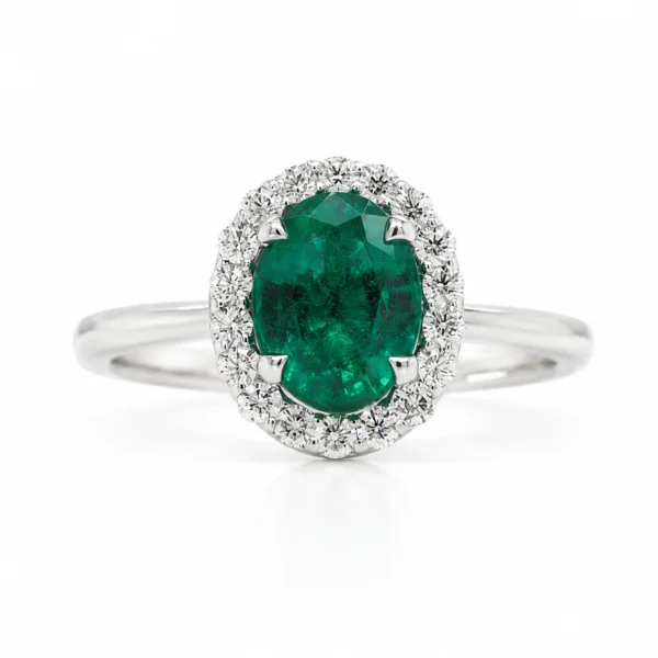 Emerald And Diamond Halo Ring In 18K White Gold