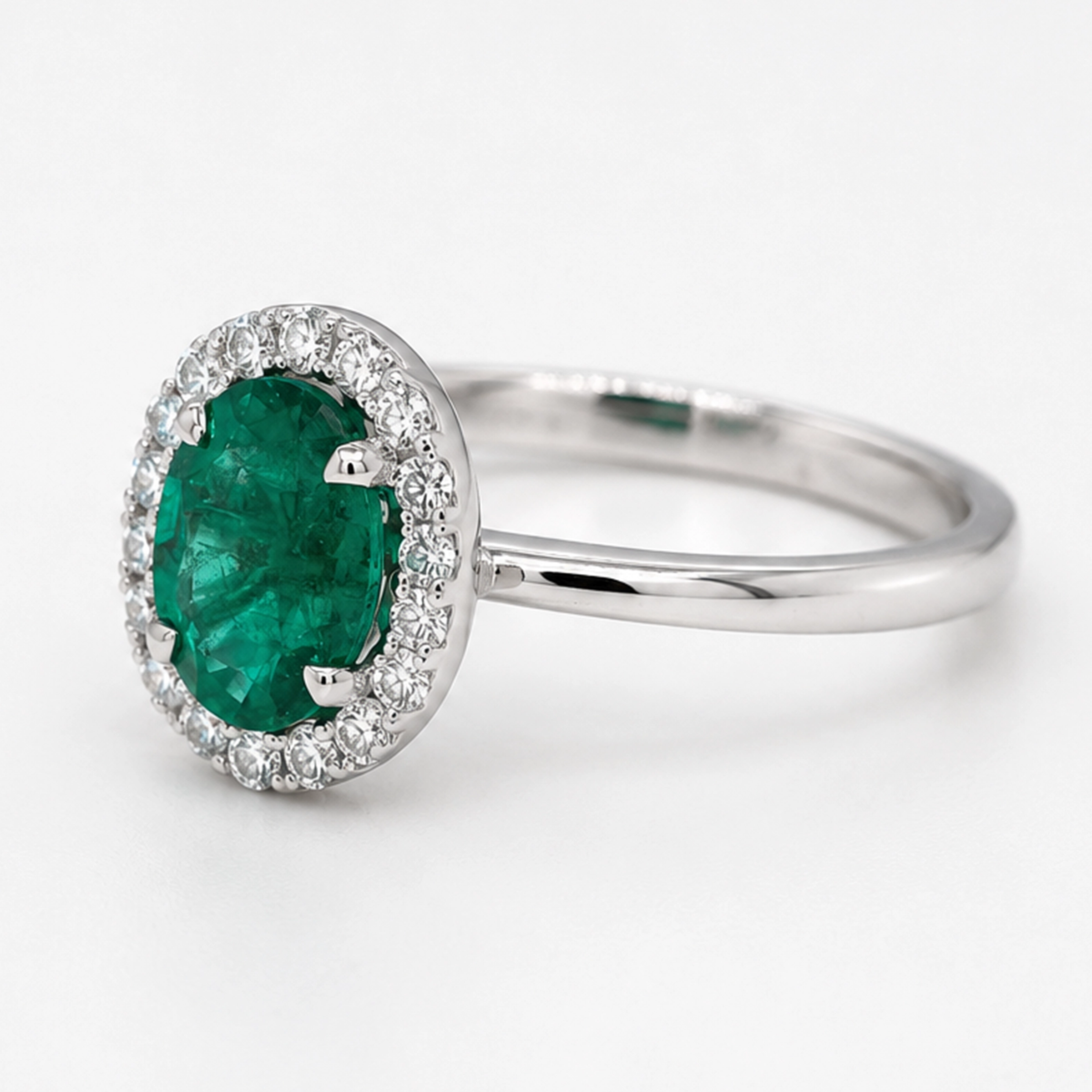 Emerald And Diamond Halo Ring In 18K White Gold5 Emerald And Diamond Halo Ring In 18K White Gold