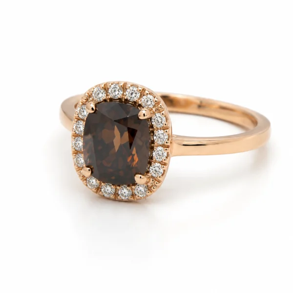 Angled view of a 1.52 ct Fancy Dark Brown cushion diamond ring with a white diamond halo in 18k rose gold.